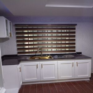Zebra roller blinds in modern kitchen