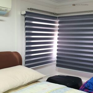 Modern living room in Bangladesh with zebra roller blinds letting in soft natural light while keeping privacy and style.